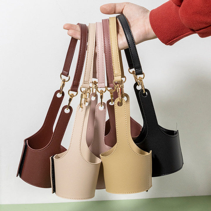 Set of two portable vegan leather cup holders, one black, one brown, for versatile use