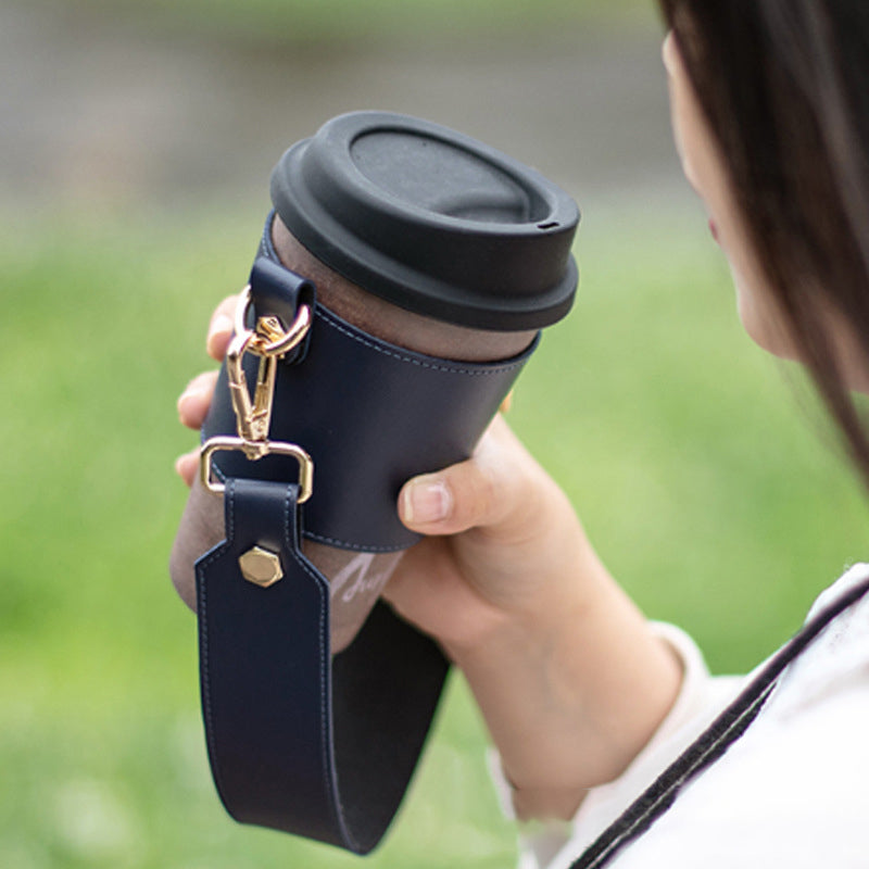 Top-down view of a vegan leather cup holder, ready to securely hold multiple beverages
