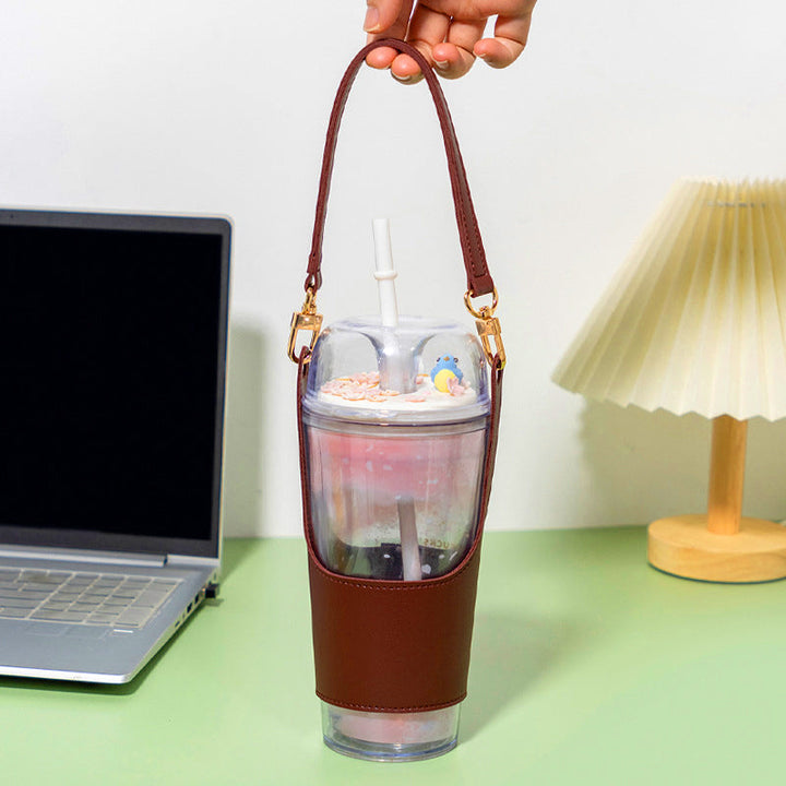 Detail of the comfortable handle on a portable vegan leather cupholder, assuring a firm grip