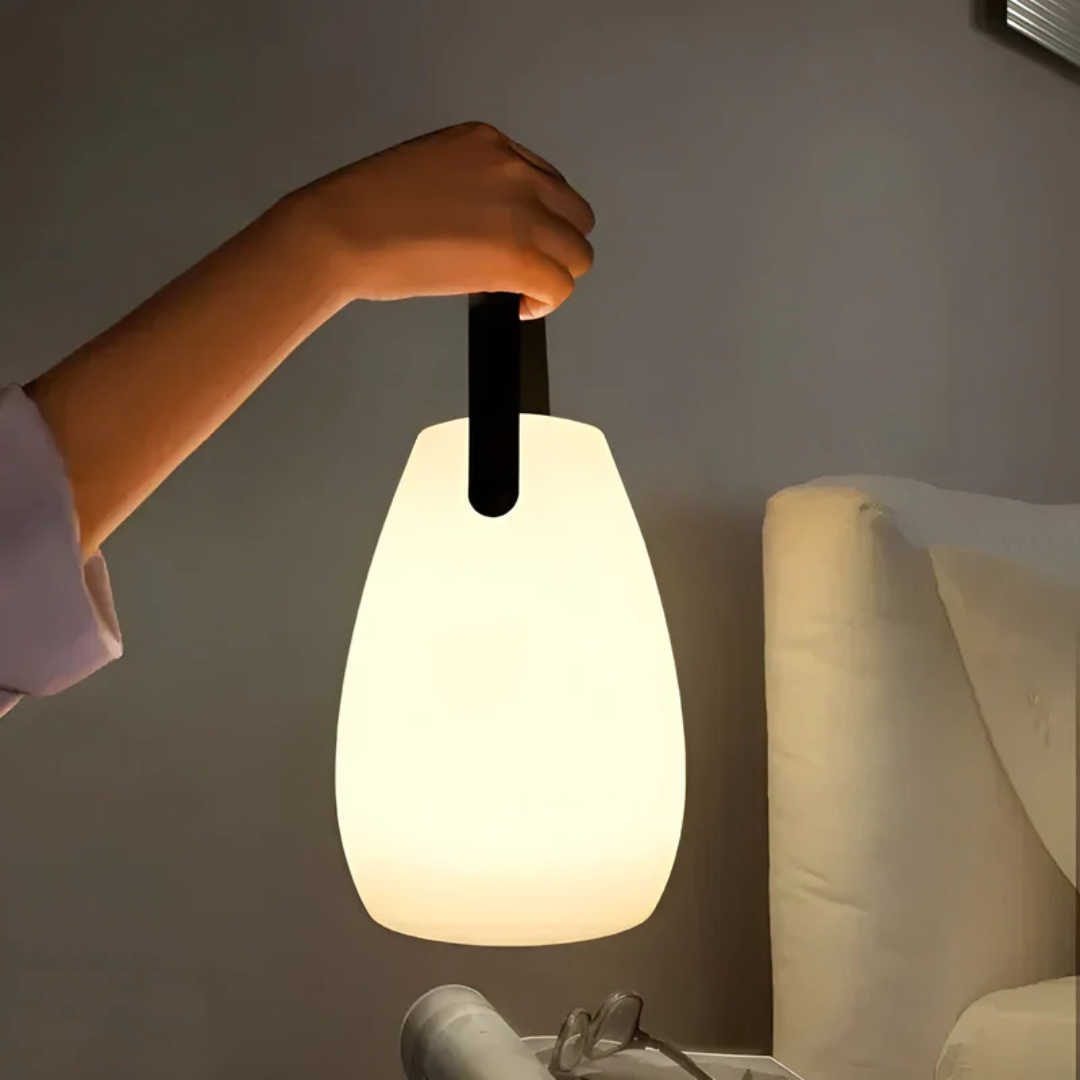 Portable wireless LED table lamp, waterproof for indoor/outdoor use, modern design.