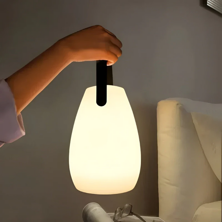 Portable wireless LED table lamp, waterproof for indoor/outdoor use, modern design.