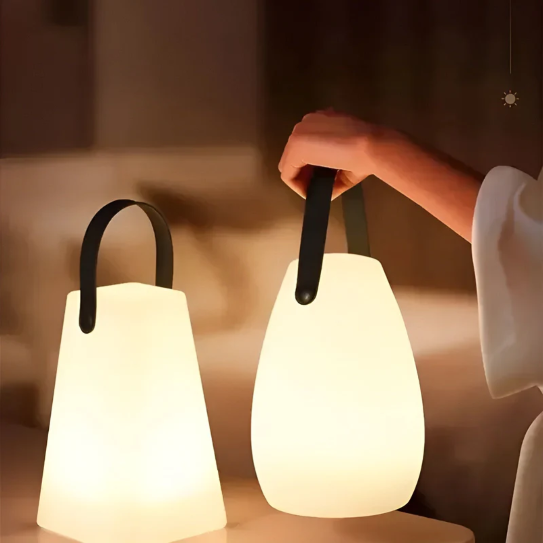 Ambiance-setting LED table lamp, wireless & rechargeable, waterproof for patio or home.