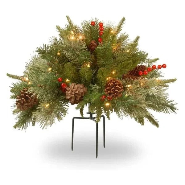 Festive pre-lit LED evergreen urn filler for outdoor or indoor holiday decoration. Battery operated Christmas accent.