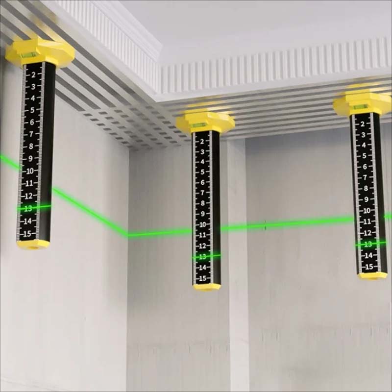 Worker accurately leveling tiles with a magnetic level tool on a bathroom floor project.