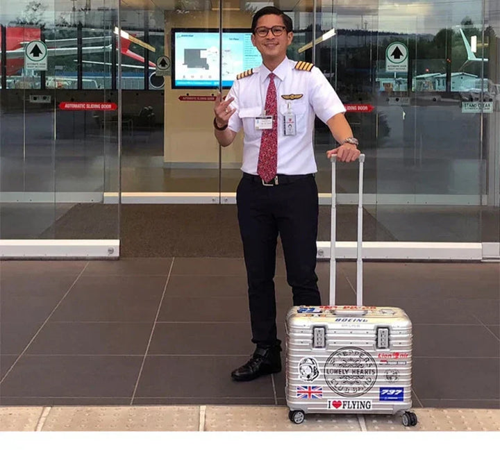 Stylish silver aluminum hardshell checked luggage. Durable, secure, and easy for international travel.