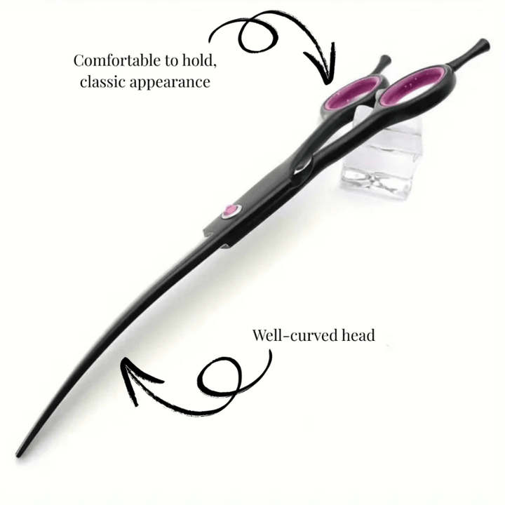 Close-up of a curved pet grooming scissor, perfect for delicate areas on dogs & cats. Professional animal care tool.