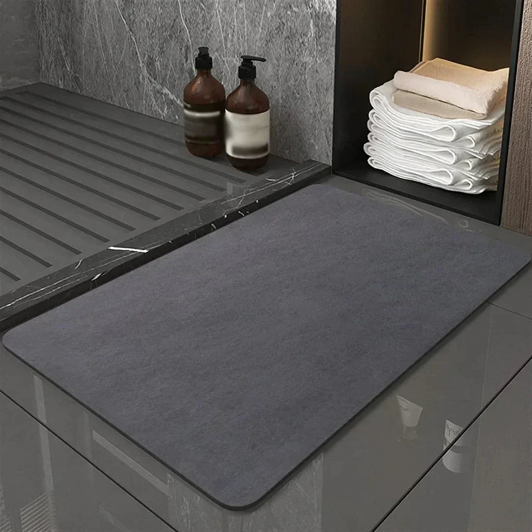 Quick dry diatomite bath mat with anti-slip backing, perfect for absorbent bathroom floor safety.