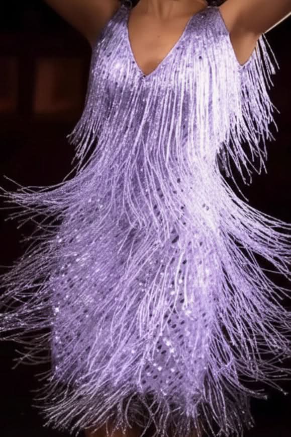 Radiant women's party dress with A-line silhouette & shimmering fringe. Perfect for a glamorous statement.