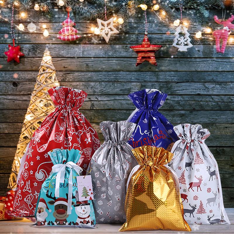 Red festive drawstring gift bag, perfect for Christmas and holiday packaging. Reusable party supply.