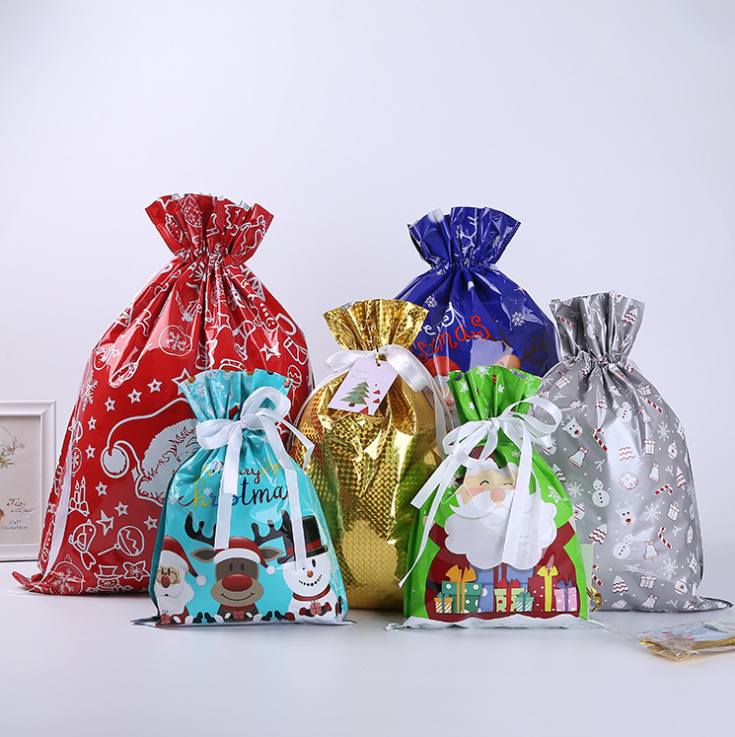 Unisex festive drawstring gift bags in a variety of colors, great for Christmas gift packaging.