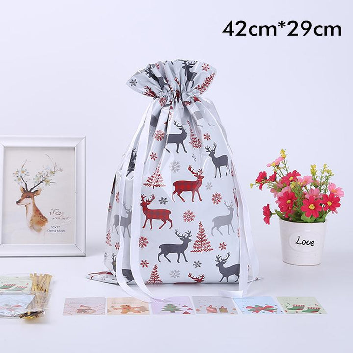 Group of holiday-themed drawstring gift bags, a versatile and reusable packaging option for parties.