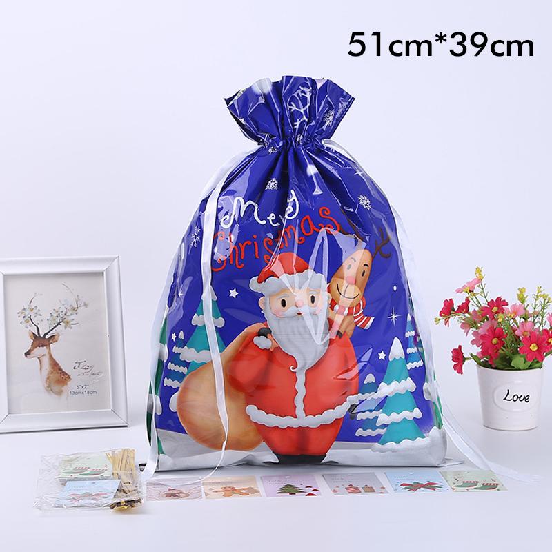 Close-up of a golden drawstring gift bag with a festive ribbon, great for holiday party supplies.