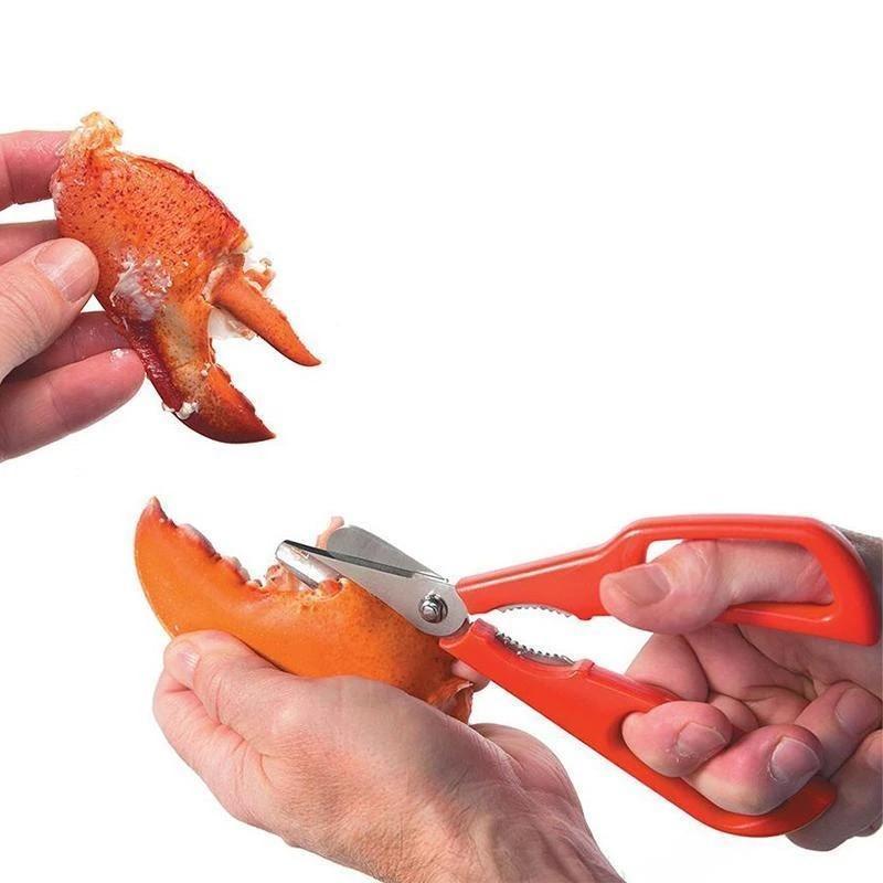 Detailed view of red seafood shears, highlighting robust stainless steel construction, crab opener