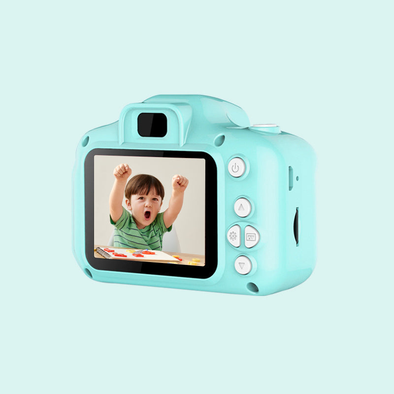 Front view of a blue kids' reusable mini digital camera, displaying its lens and flash for bright photos.