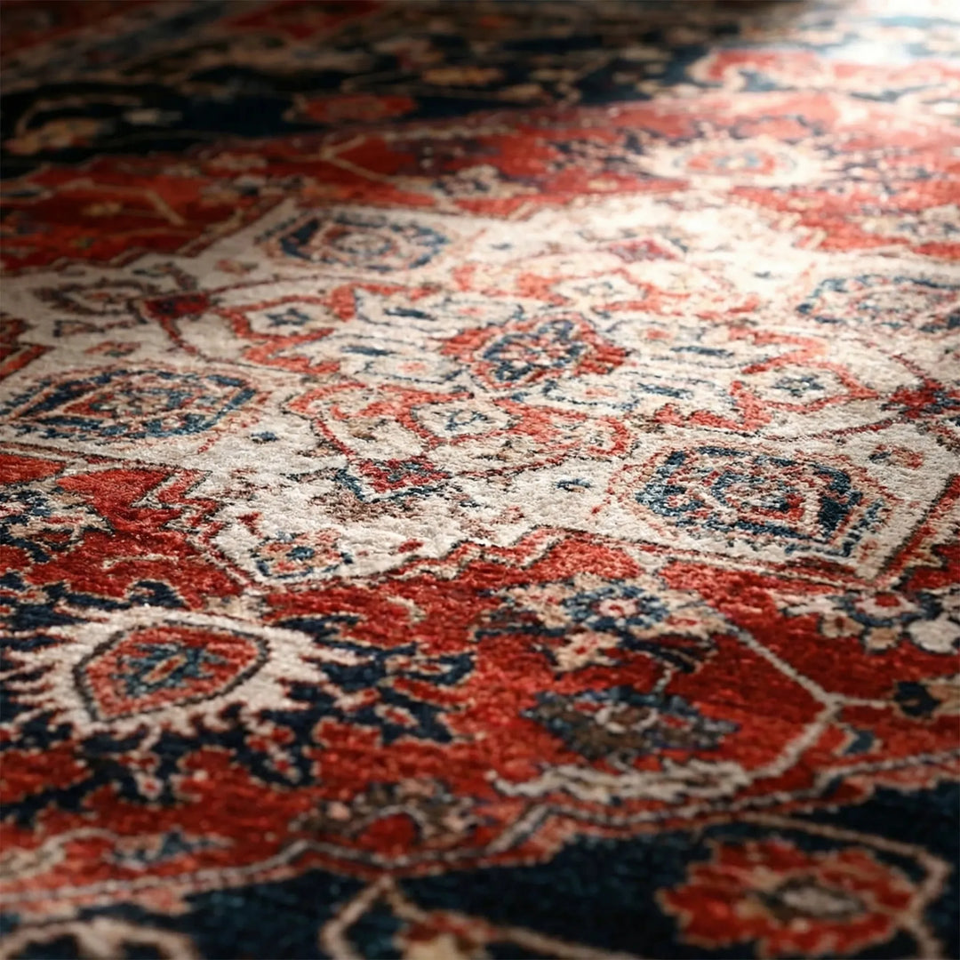 Vibrant orange, blue & red oriental low pile area rug with medallion pattern, ideal for living room decor.