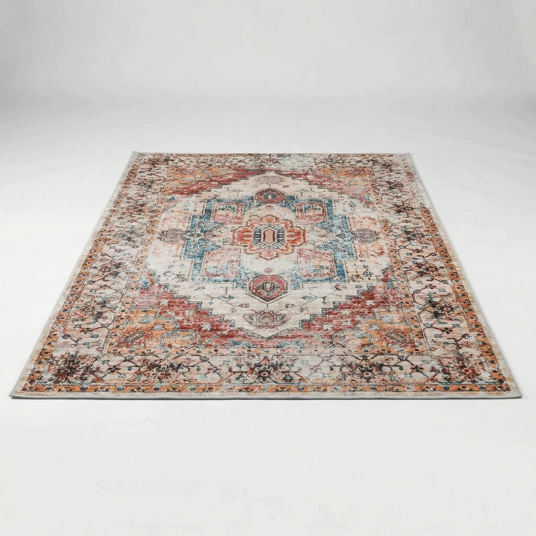 Versatile low pile oriental area rug featuring an intricate red, blue & orange pattern, great for any room.