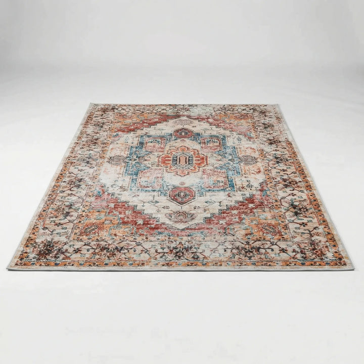 Versatile low pile oriental area rug featuring an intricate red, blue & orange pattern, great for any room.