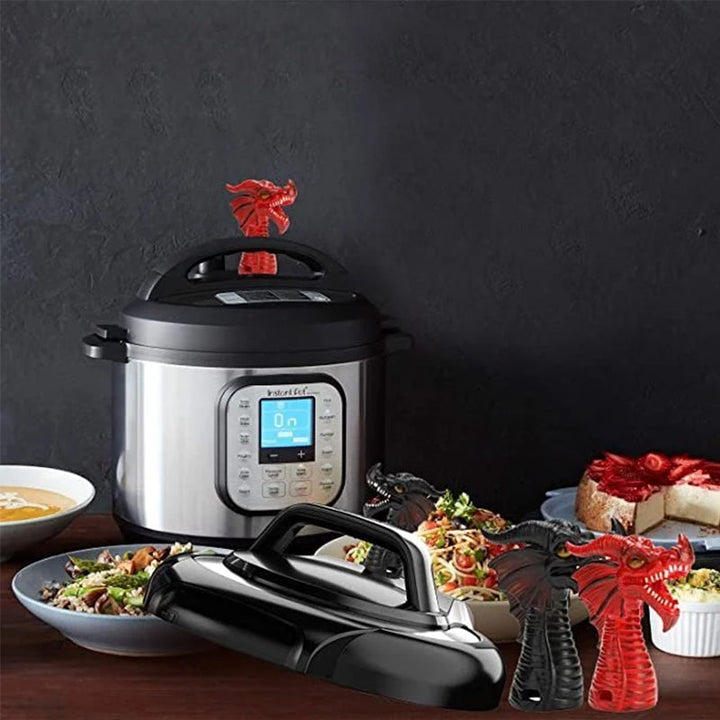 Side view of a red silicone dragon steam diverter, practical kitchen accessory for cooker