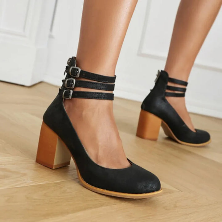 Detail of triple straps on women's block heel pumps, highlighting secure and stylish fit