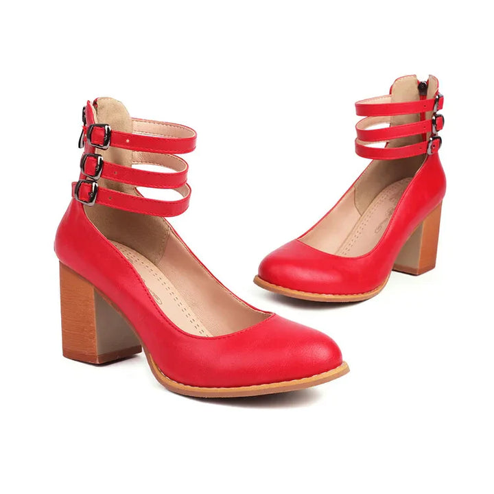 Close-up of the comfortable block heel on women's triple strap pumps, durable design