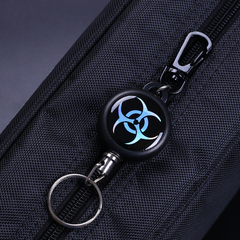 Convenient retractable key ring with a flexible wire cord, offered in a useful 3-piece set for security.