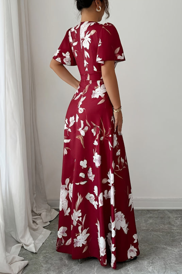 Flowy women's midi dress with a retro floral pattern, elegant pleats, and ruffled sleeves.