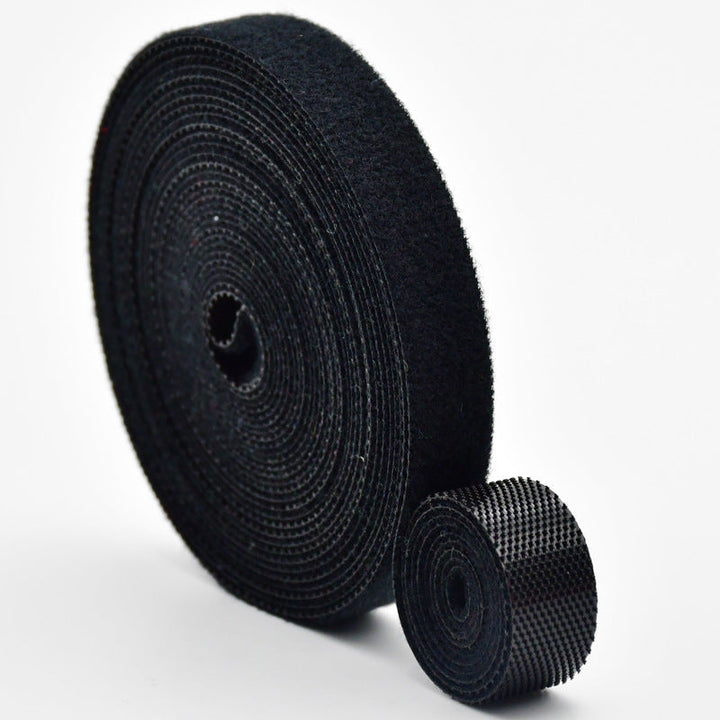 Assorted reusable cord management ties for various electrical wires and tech gadgets.