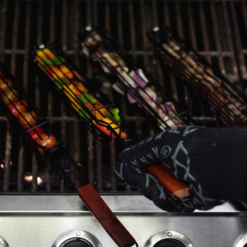 Assortment of grilled kabobs in nonstick baskets, showcasing perfectly cooked vegetables and meats on the BBQ.
