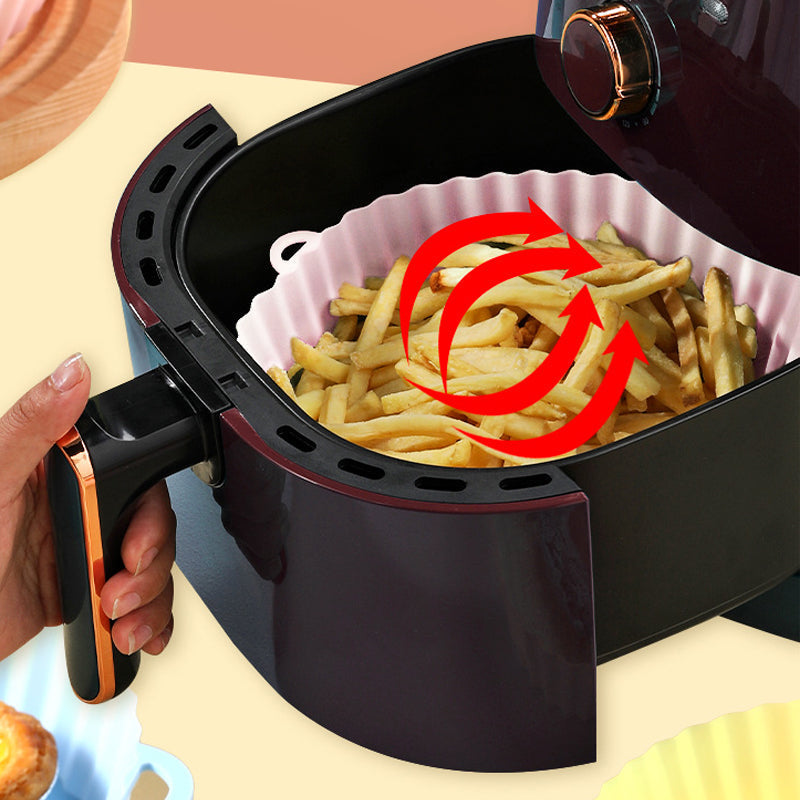 Close-up of a non-stick reusable silicone air fryer tray, showing flexible design and ridges