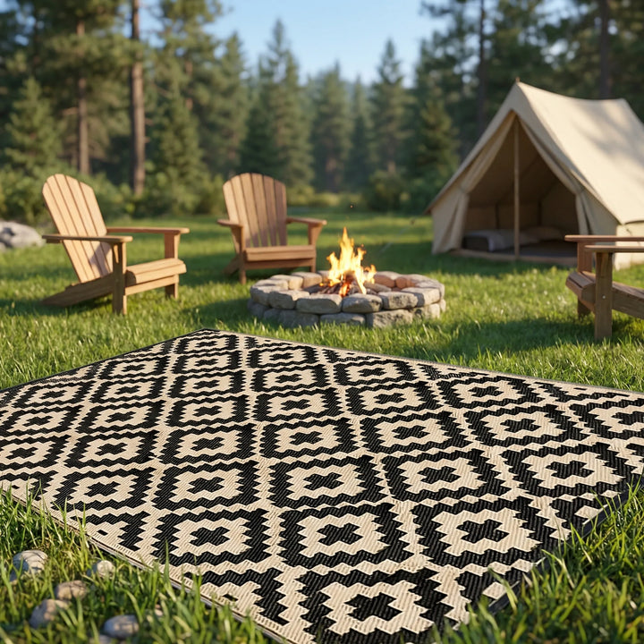 Reversible boho outdoor rug for patio & deck, featuring a water-resistant wavy geometric pattern. Easy clean camping mat.