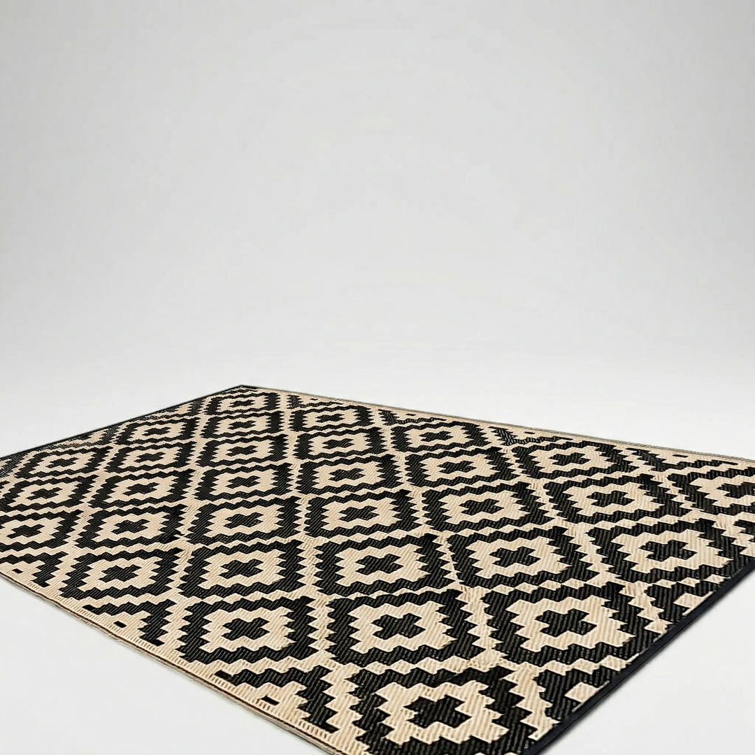 Boho outdoor reversible rug with a distinct wave pattern. Perfect for patio, deck, camping, picnics. Water-resistant & easy clean.