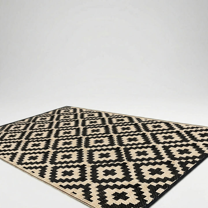 Boho outdoor reversible rug with a distinct wave pattern. Perfect for patio, deck, camping, picnics. Water-resistant & easy clean.