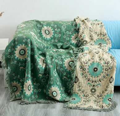 Cozy cotton throw blanket, reversible with charming Scandinavian bird and subtle floral patterns.