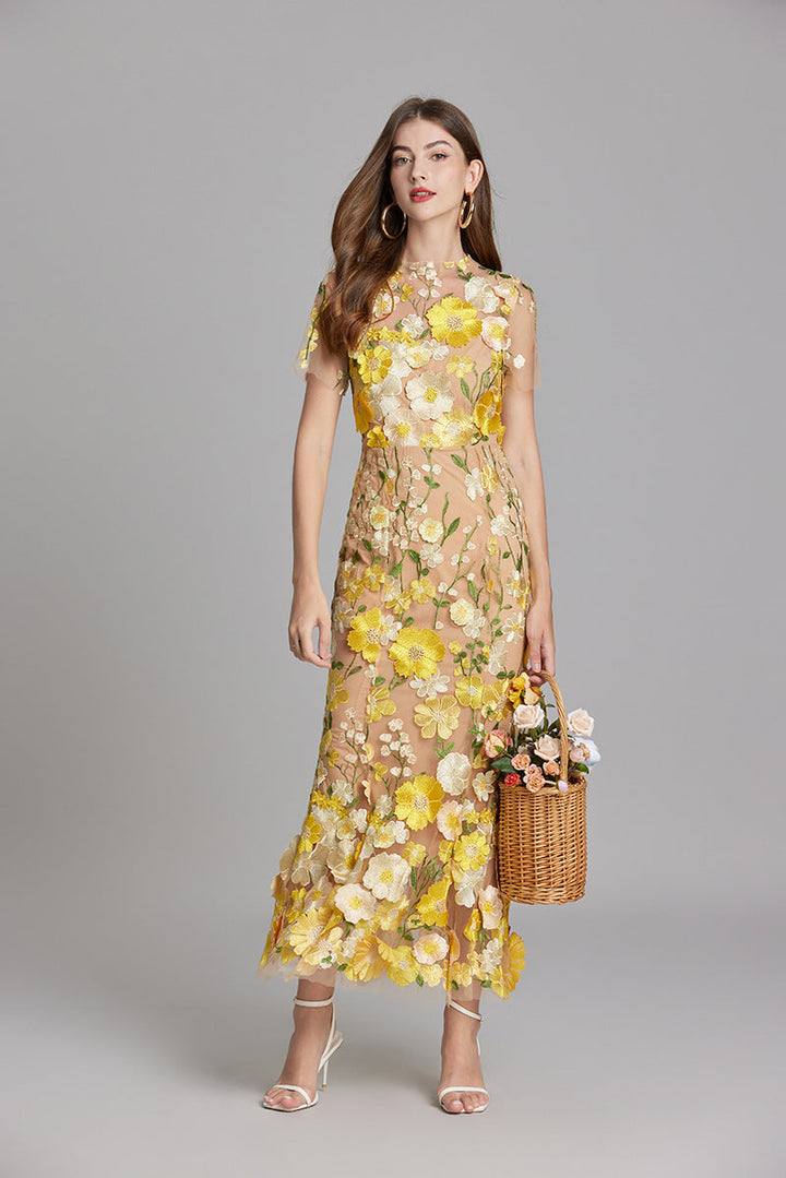 Long elegant women's evening gown with romantic floral appliqué & mermaid cut.