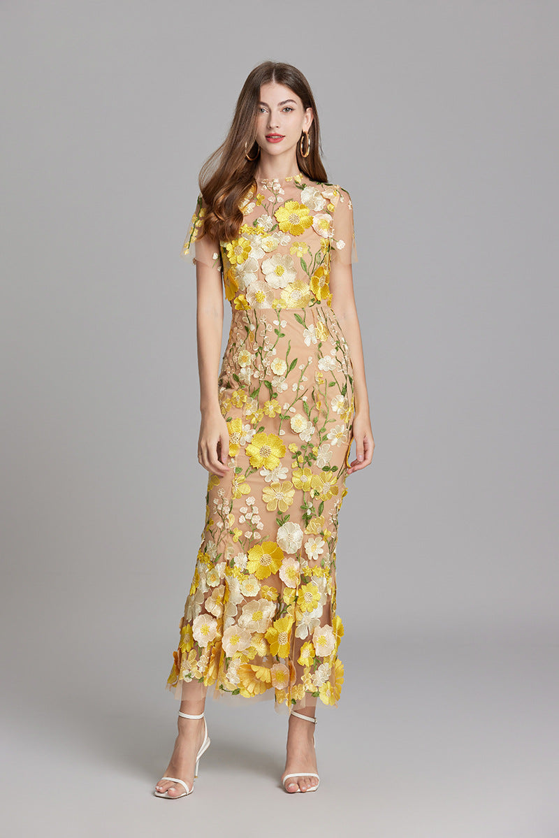 Women's illusion neckline mermaid evening gown with delicate floral appliqué.