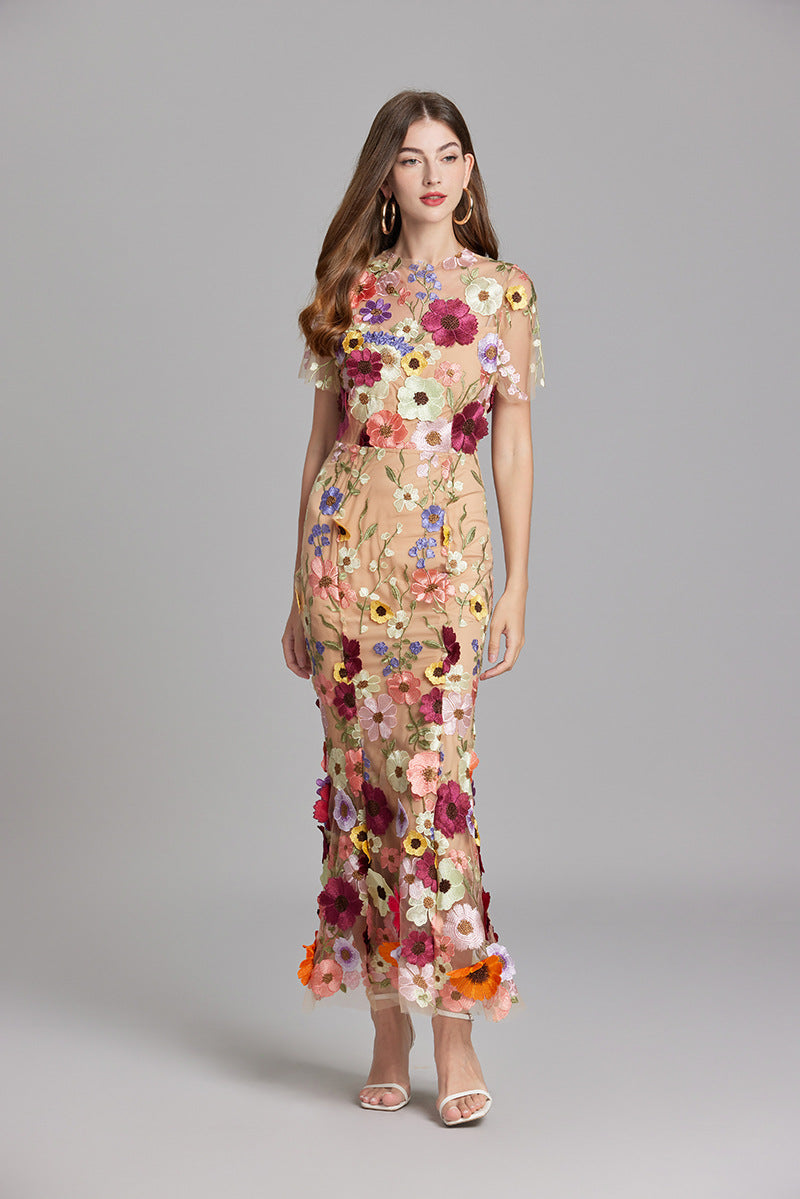 Special occasion women's evening gown with romantic floral appliqué.