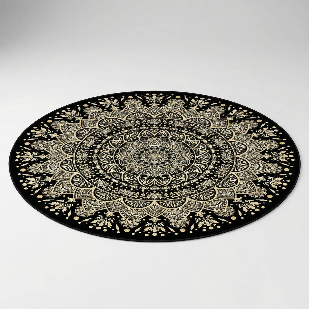 Flowique round mandala area rug in black & gold for modern living rooms. Washable, non-slip decorative bedroom rug.