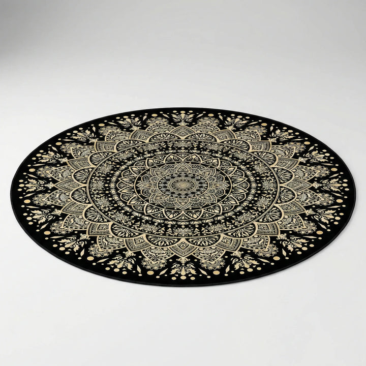 Flowique round mandala area rug in black & gold for modern living rooms. Washable, non-slip decorative bedroom rug.