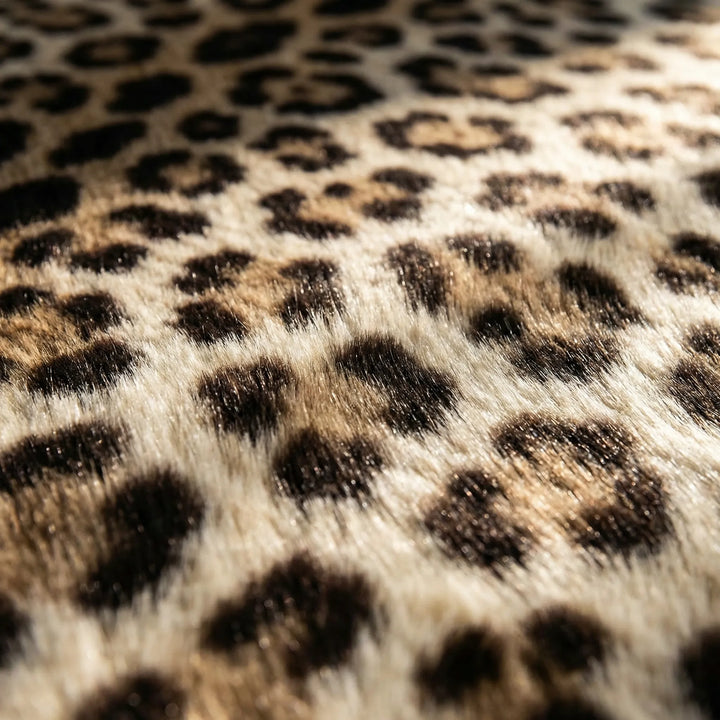 Modern round leopard print area rug with wave design, ideal for contemporary home decor.