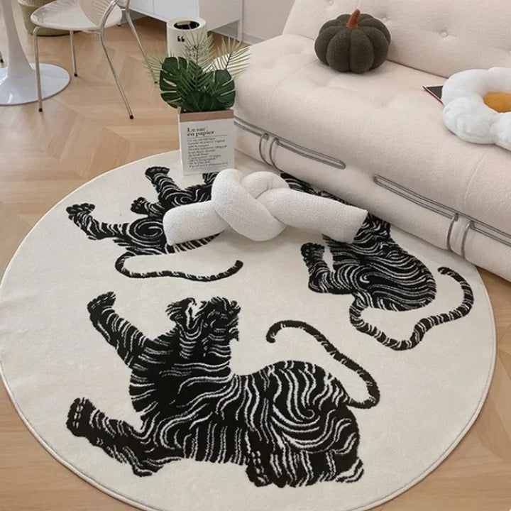 Soft plush round tiger print area rug for home decor. Distinctive wave pattern adds statement style to any room.