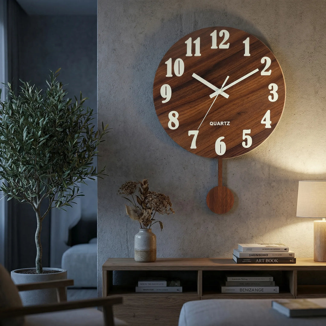 Round wall clock with a silent pendulum and integrated nightlight, perfect for modern home decor.