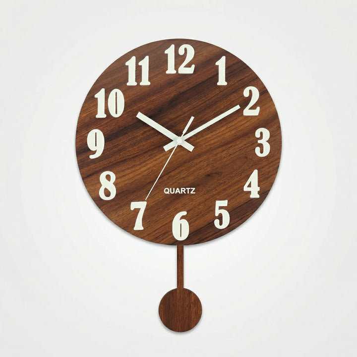 Battery-powered round analog wall clock featuring a classic pendulum and soft nightlight for any room.