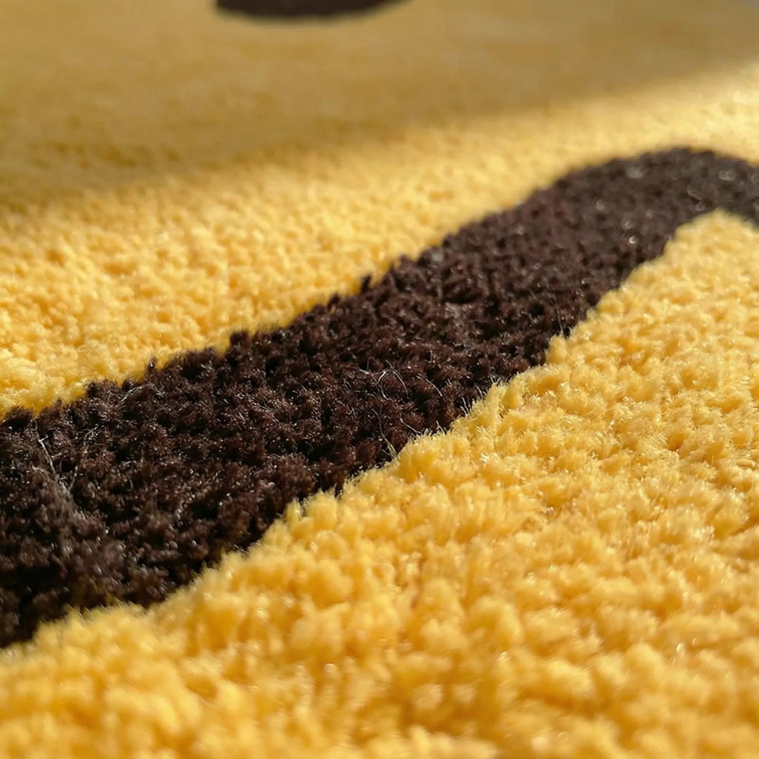 Unisex round yellow rug featuring a playful smile face and subtle wave design.