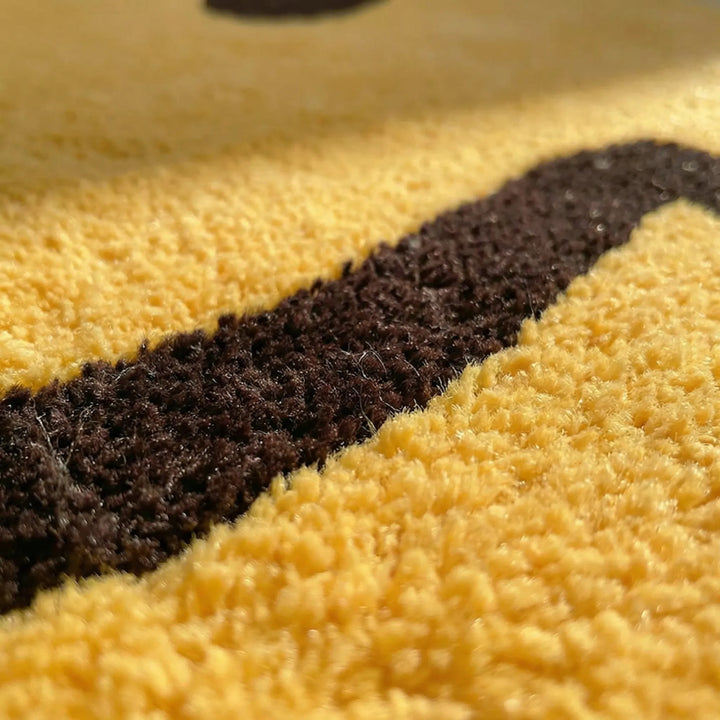 Unisex round yellow rug featuring a playful smile face and subtle wave design.