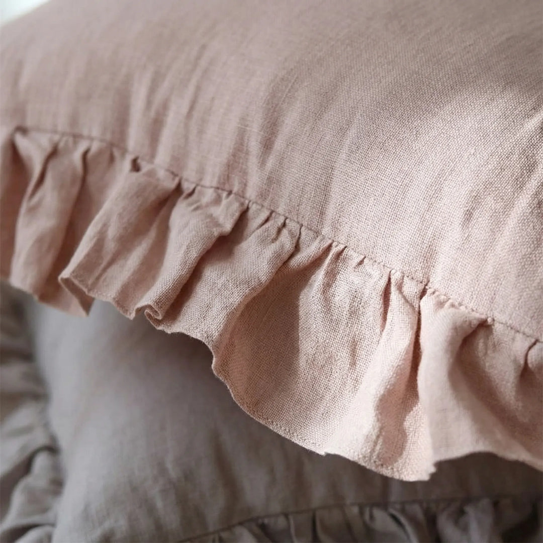Soft textured square cushion cover with stylish ruffles, ideal for contemporary home decor.