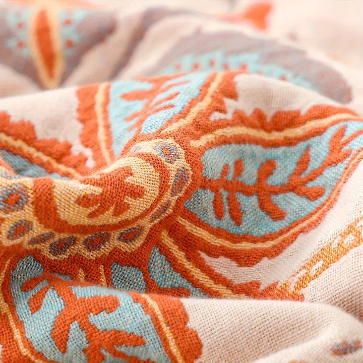 Soft rustic floral pattern cotton blanket, a stylish boho home accent.