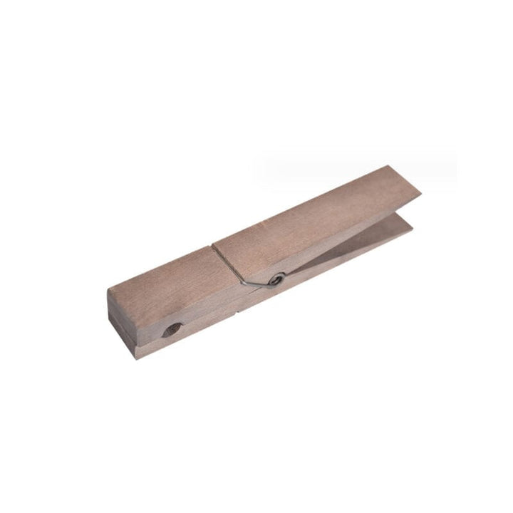 Wooden clothespin towel holder with rustic finish, ideal for bathroom or laundry room organization.