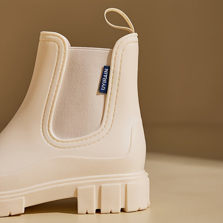 Stylish Selora women's mid-height waterproof boots with anti-slip grip, great for various wet weather.