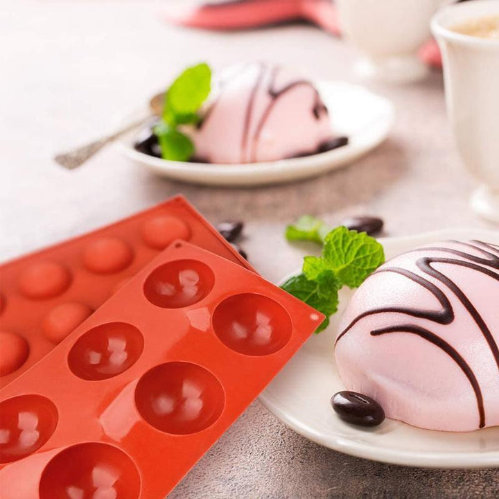 Non-stick silicone baking mold in a semi-sphere shape, perfect for DIY candy and cake decorations.