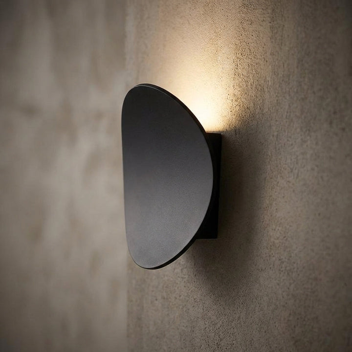 Serevex Minimalist LED wall sconce, modern aluminum design, providing warm ambient light for indoor home decor.